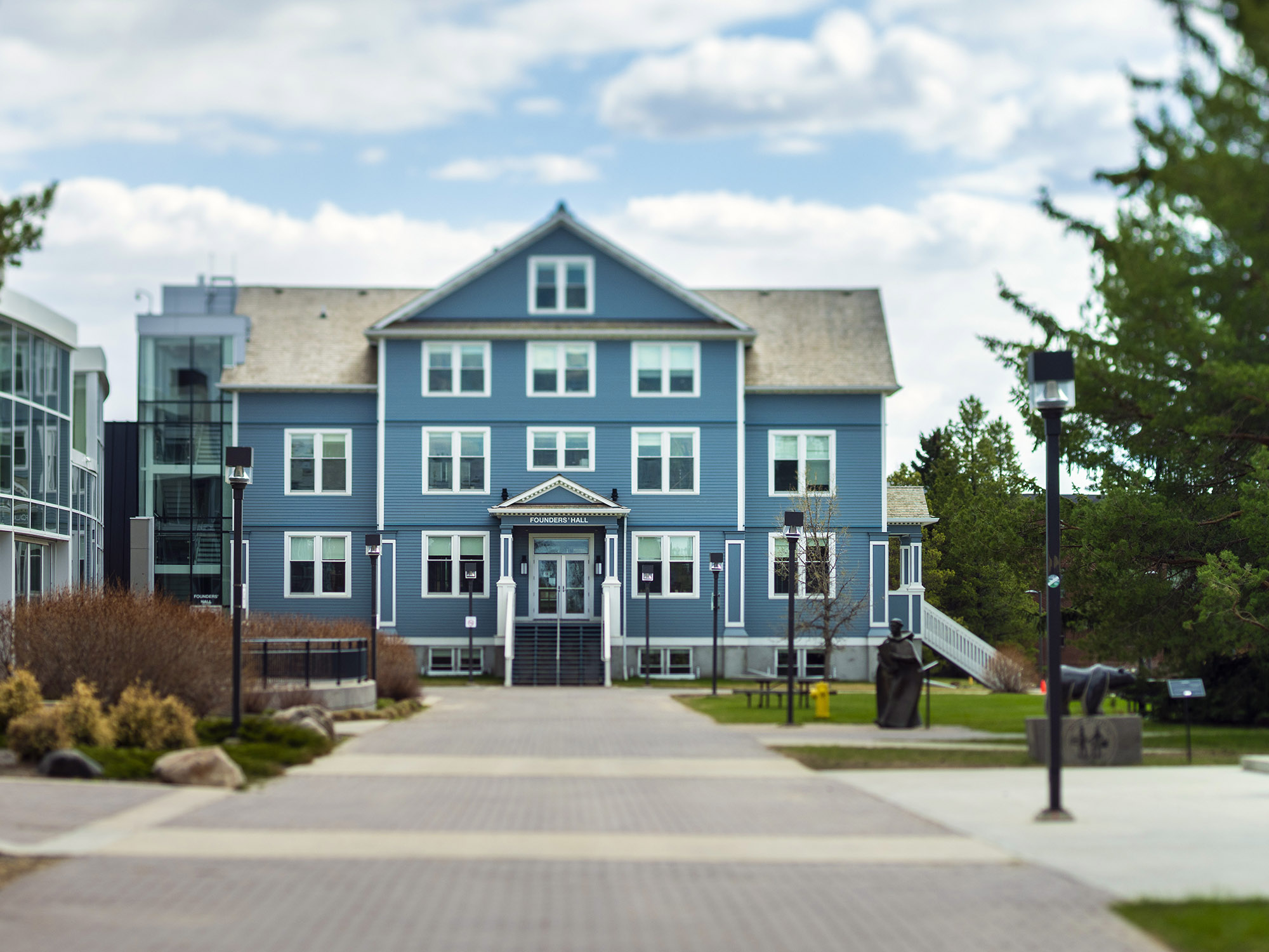 Exterior of Founders' Hall at the end of a stone path.