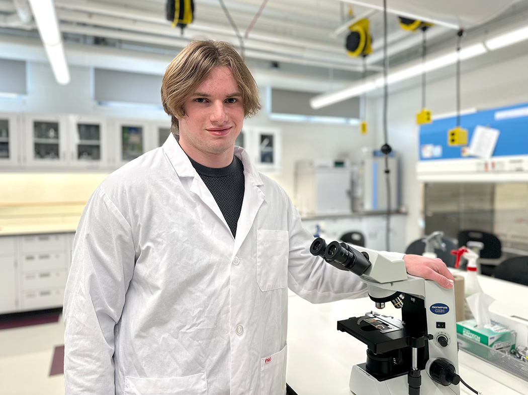 Portrait of Daimen Asp in a lab at Augustana Campus