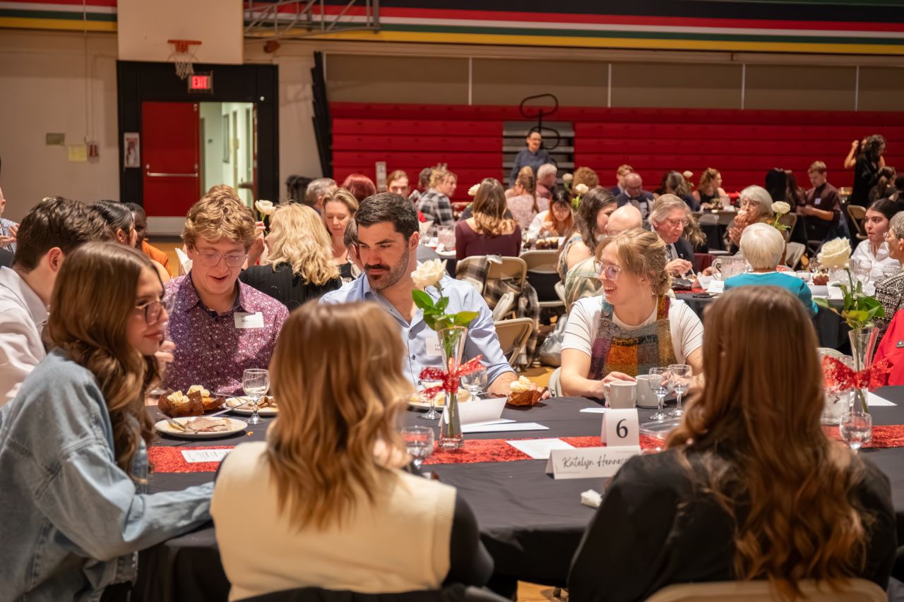 A group of people at a table at the Community Awards Banquet.