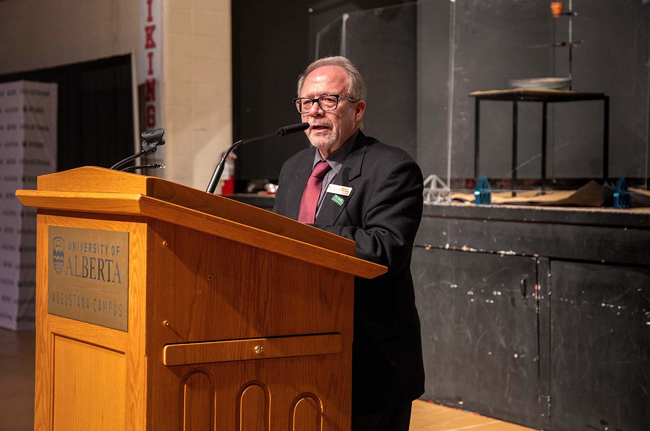A man speaking at a podium.