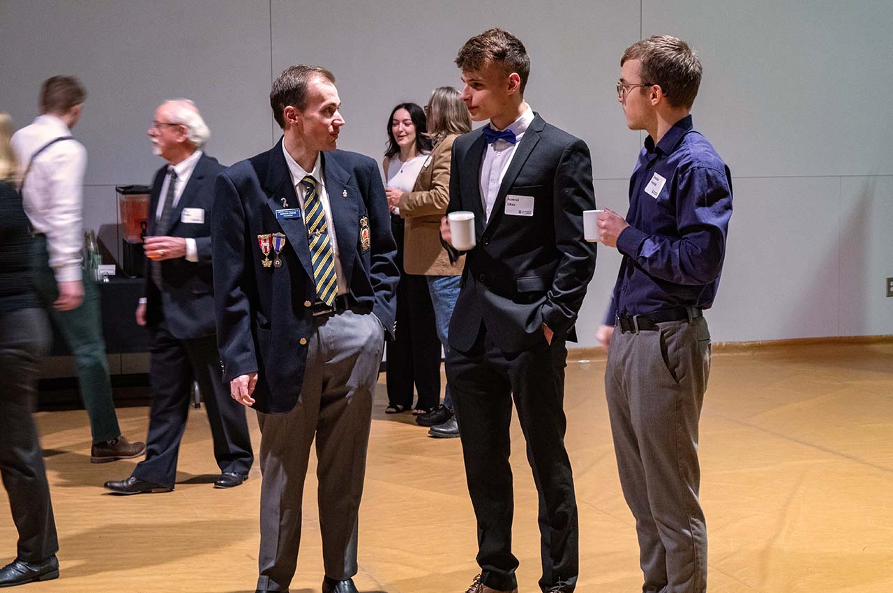 Students and donor talking.