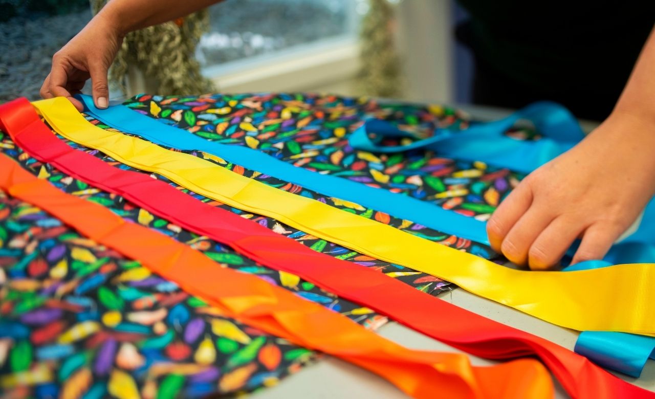 Someone planning out a design for a ribbon skirt