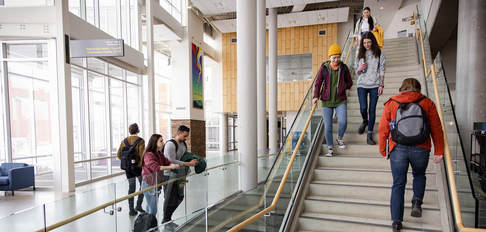 Students walking and moving about the Augustana Forum Building