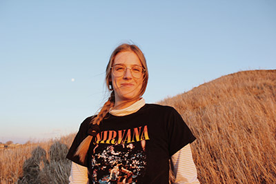 Karen Wagner posing in a field