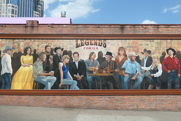 A photo of the Legends mural in Nashville featuring paintings of various country music stars.