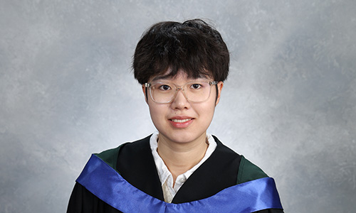 Susan Sun in graduation robes.