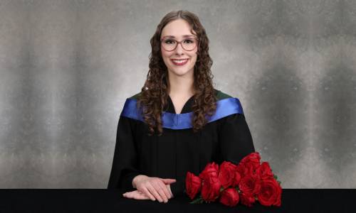 Leah Peters in graduation robes.