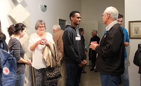 Participants talking with community members