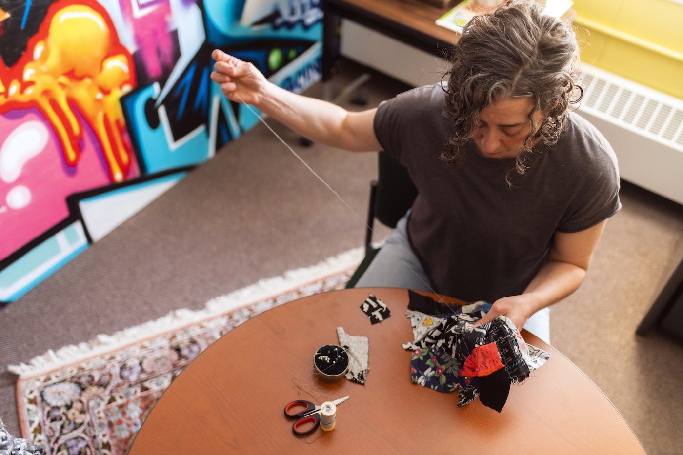 Augustana faculty member working on a textiles project