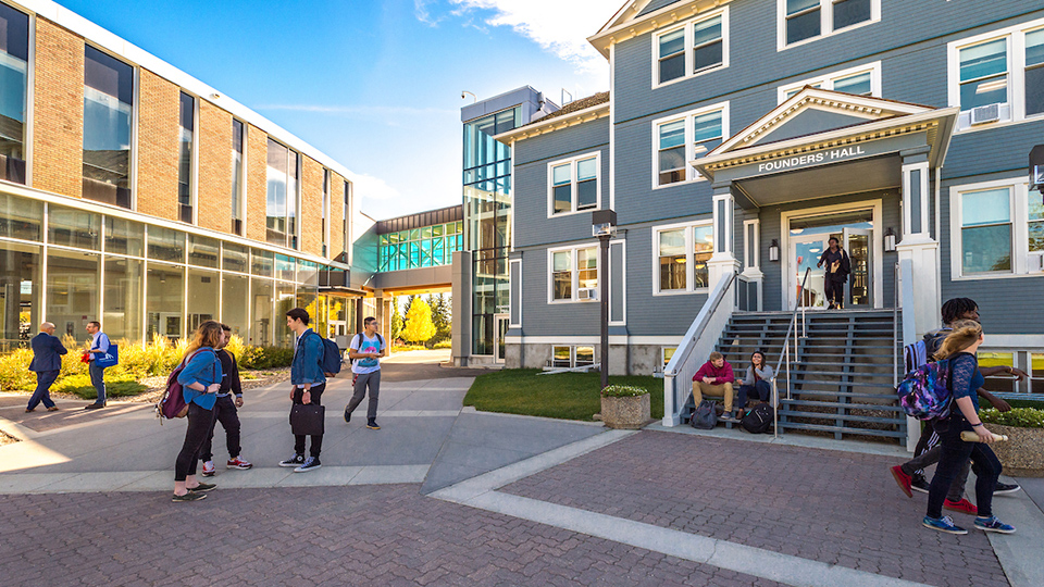 Students walking in front of Founders' Hall