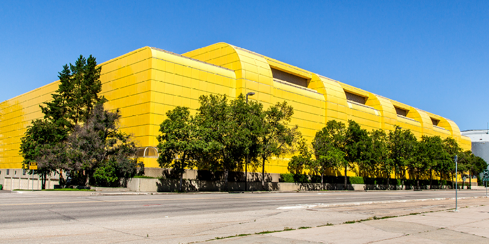 Universiade Ppavillion, also known as the Buttterdome, a bright yellow building, in summertime