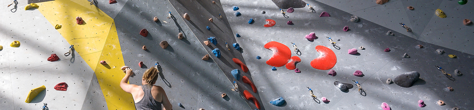 Person climbing on rock wall.