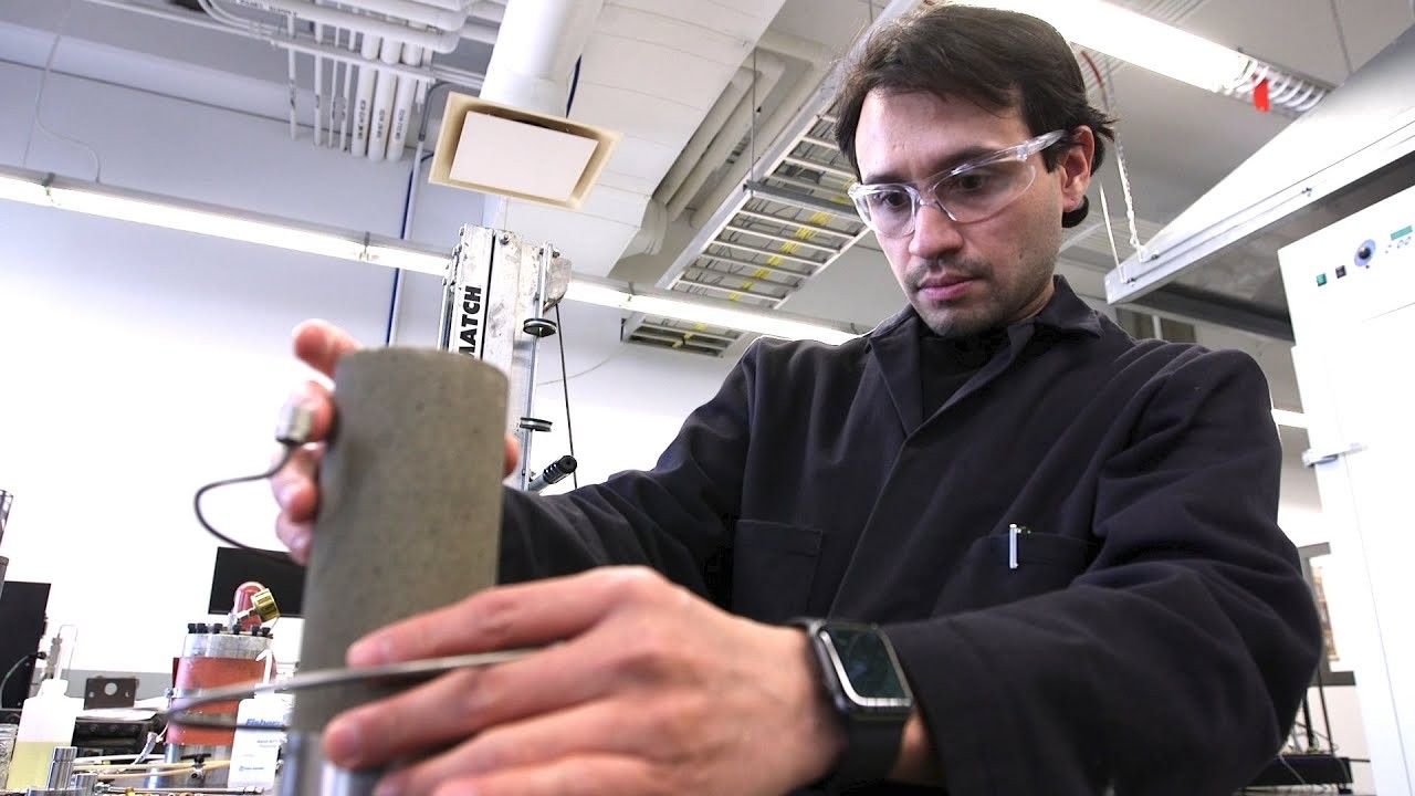 Man holding a cylinder