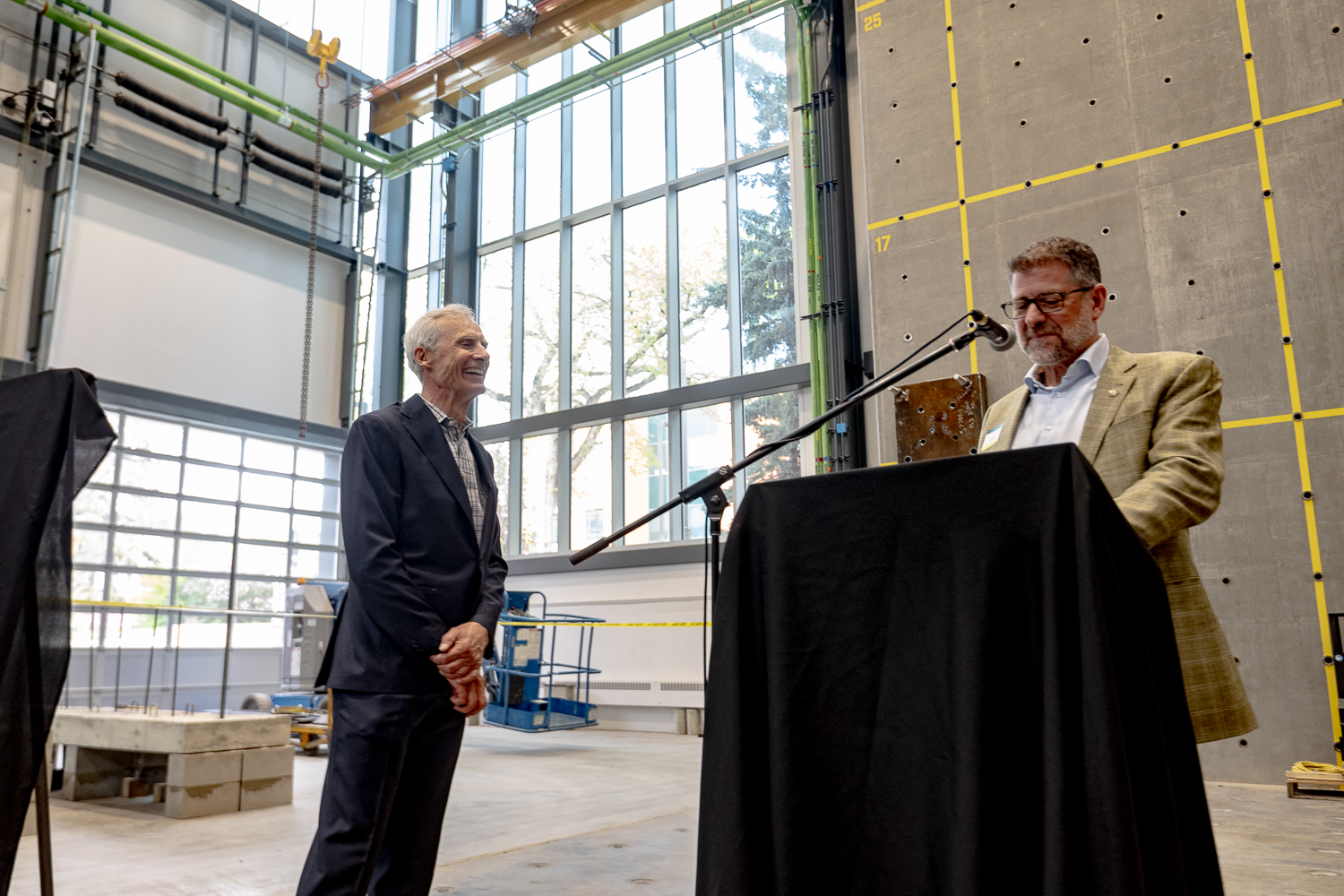 Jim Montgomery (left) being honoured by Jeff DiBattista (right) and the Friends of Dr. Jim who created the Jim Montgomery Endowment in Structural Engineering. (Photo by Christy Dean Photography)