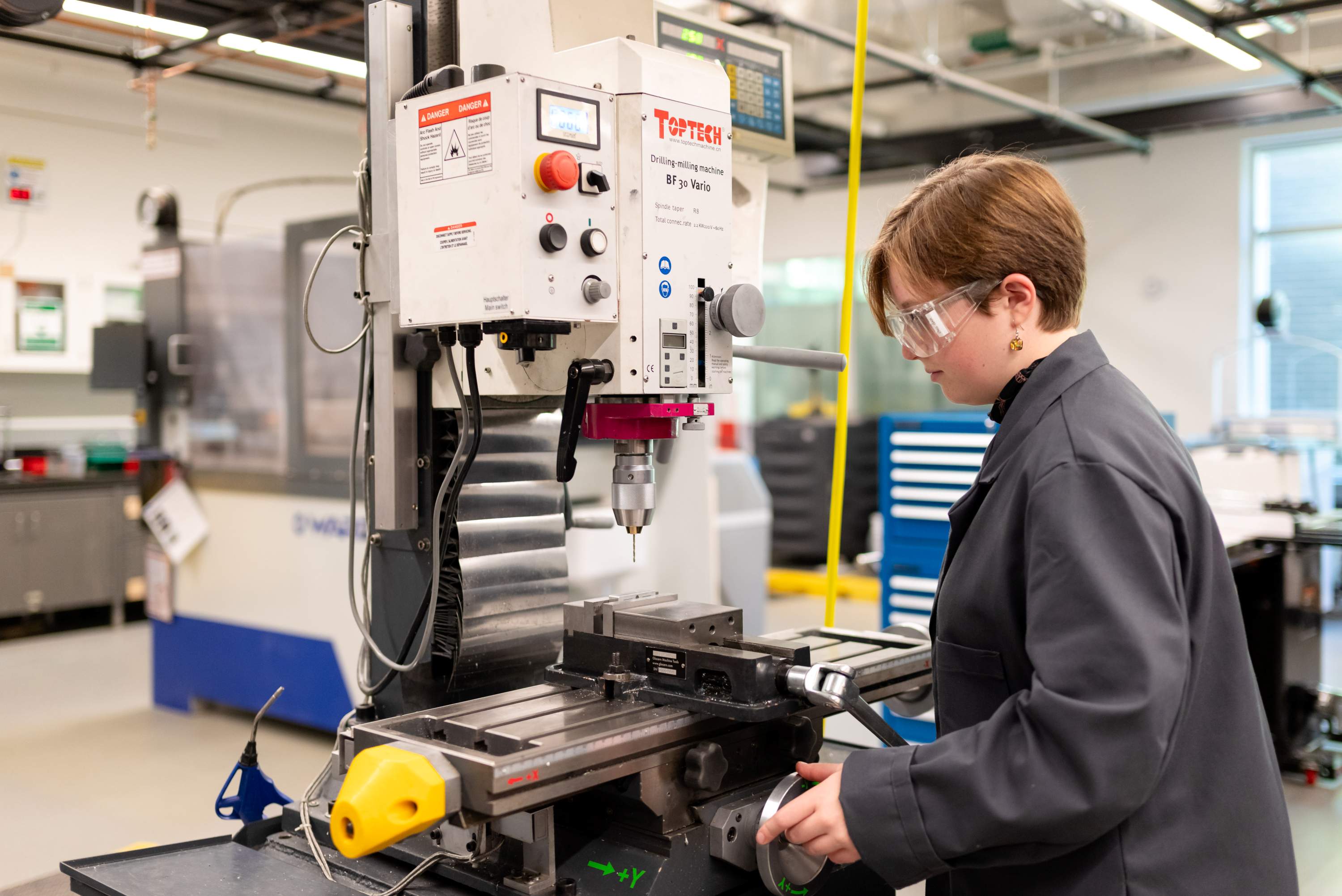 Student using a machine