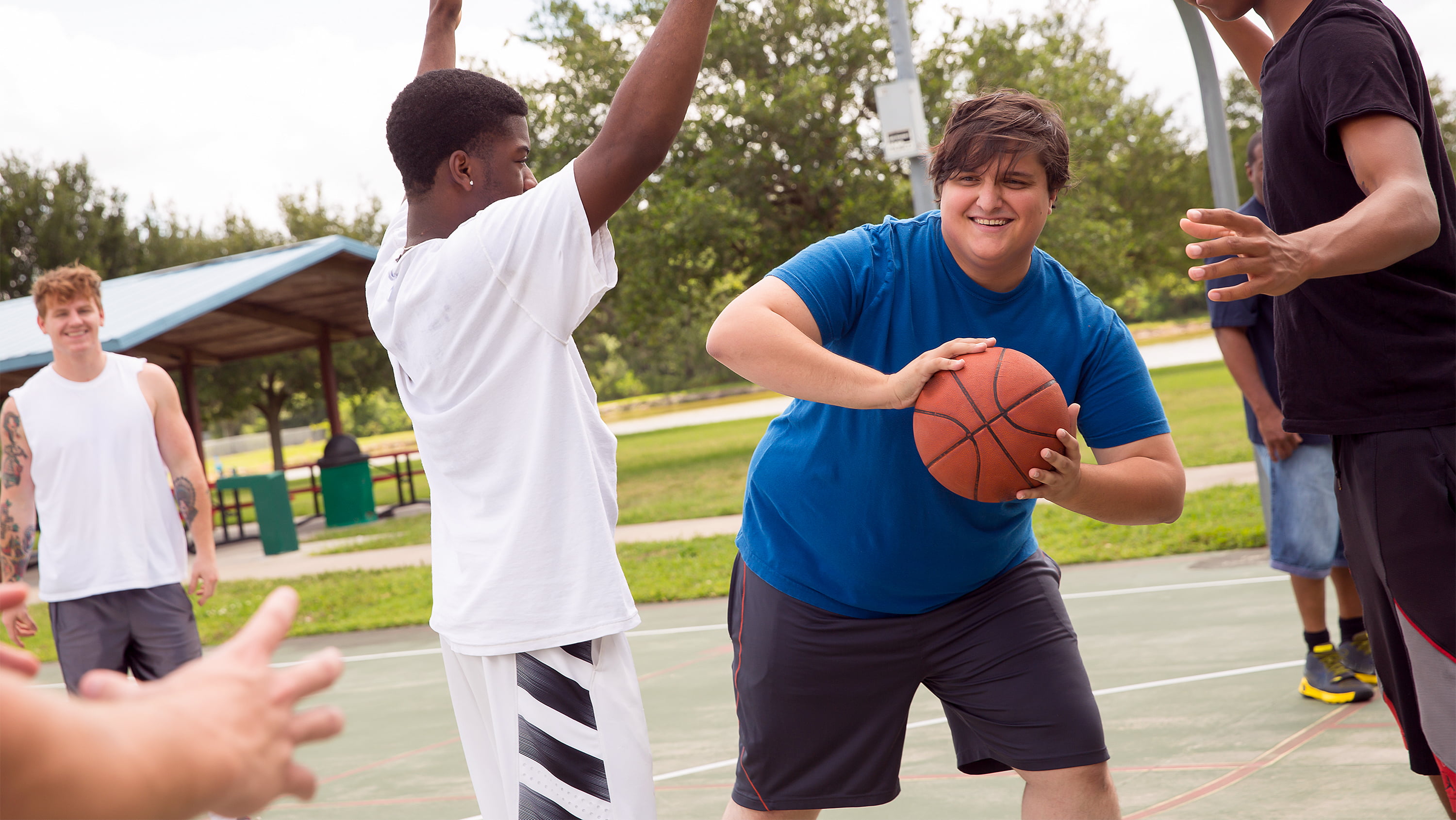 Teens play basketball. (Photo: Obesity Action Network)