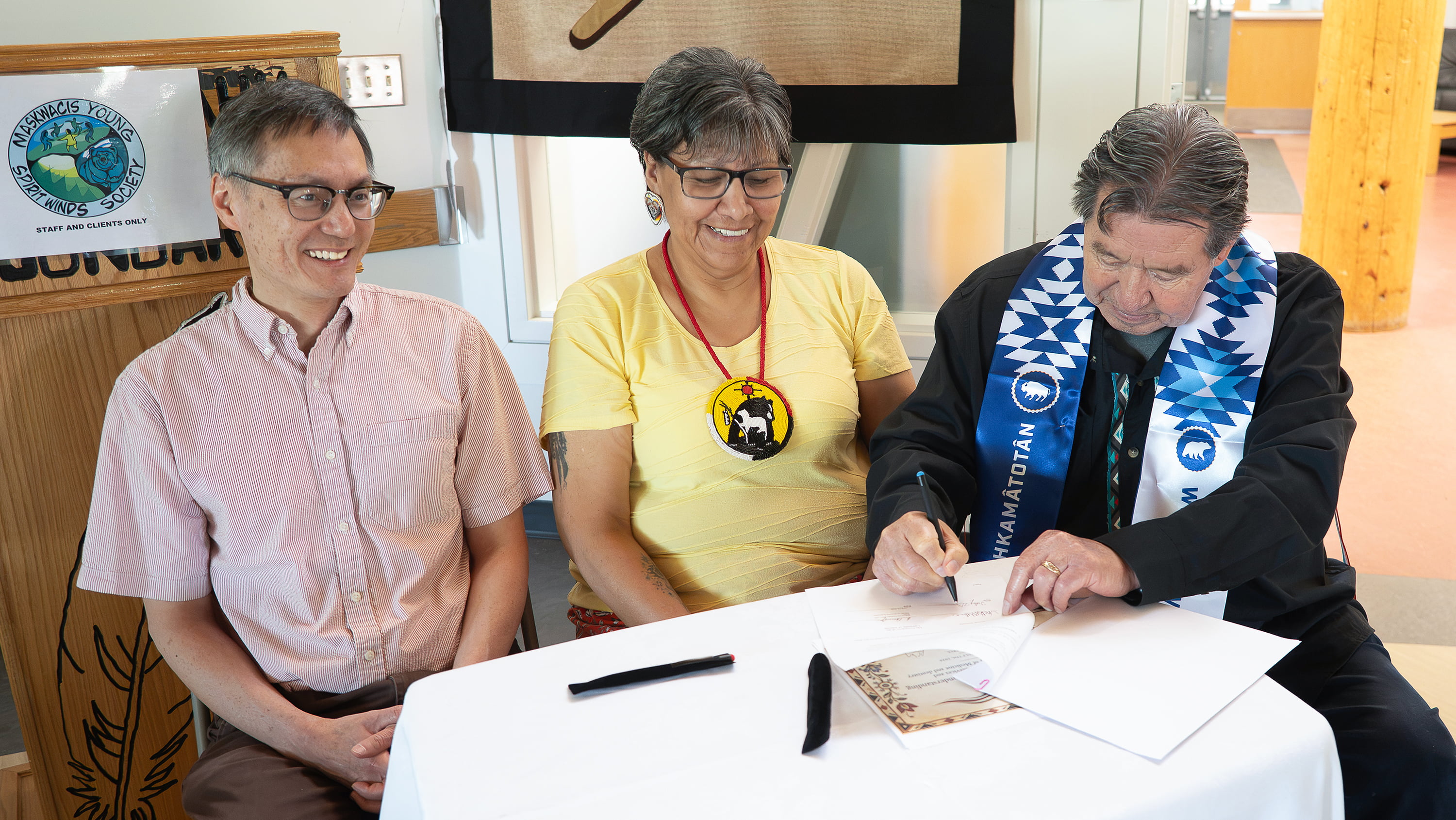 Dr. Lawrence Cheung, professor and associate dean of postgraduate medical education at the U of A, Ermineskin Cree Nation councillor Nina Makinaw, and Randy Littlechild, chief executive officer of Maskwacîs Health Services, were part of the signing ceremony held on July 7. (Photo: Christy Dean) 