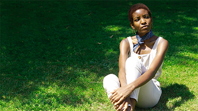 woman sitting on grass