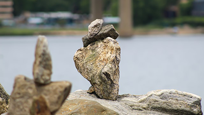 rocks stacked up near shore