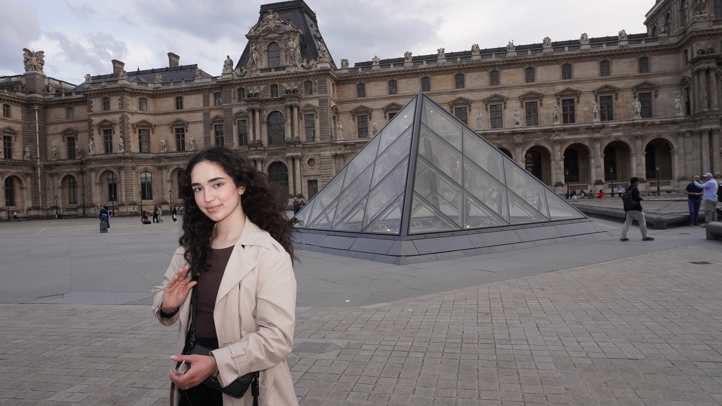 Anjum Rabbi in front of The Louvre, Paris