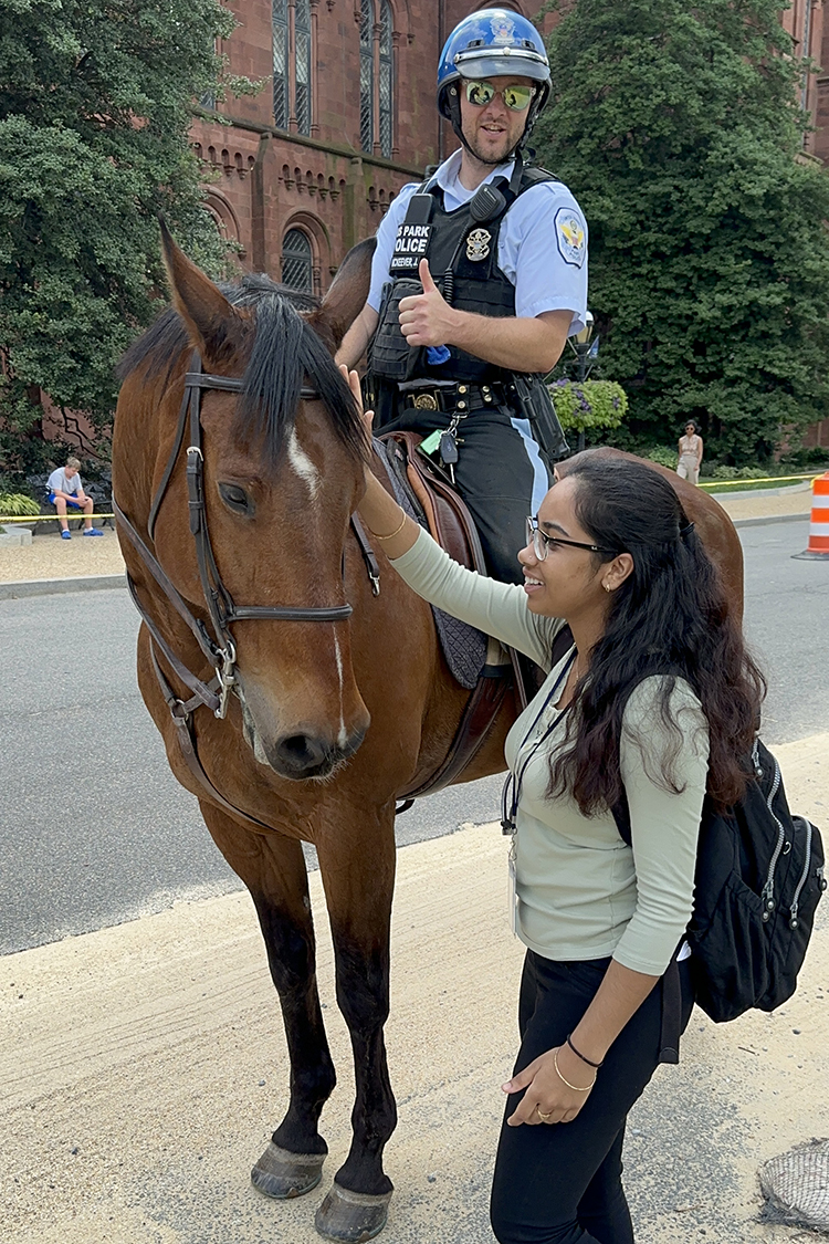 Vaishnavi with an officer on horseback