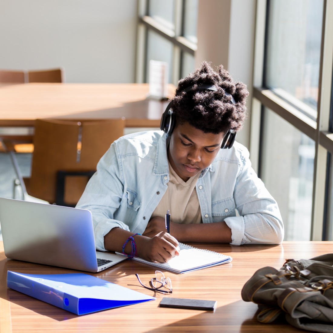 Student studying near a window