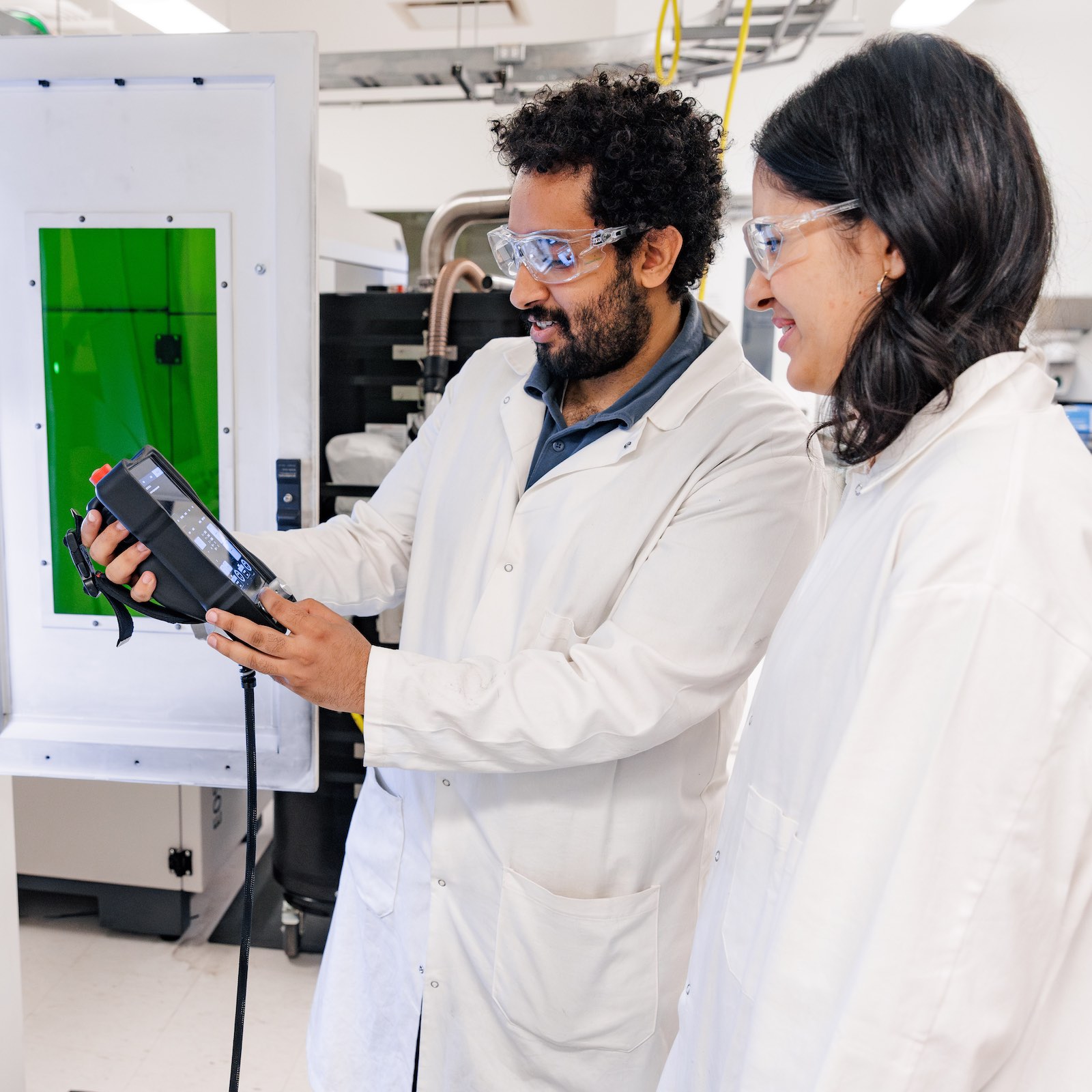 PhD student Zeyad Mohamed and Research Assistant Katrina Hamdon look at a small modular nuclear reactor