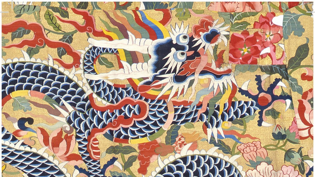 Navy dragon on a golden yellow, floral patterned background