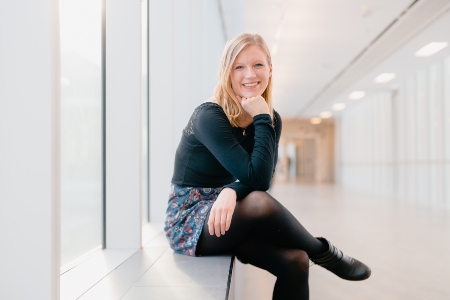 Julia Swatzky sitting by window in U of A
