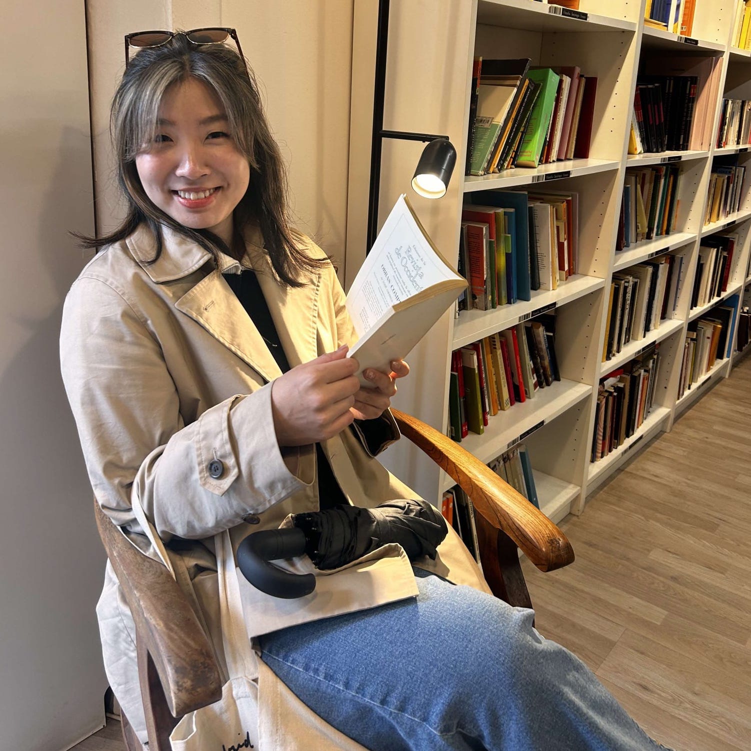 Yoojin Choi, reading in a library