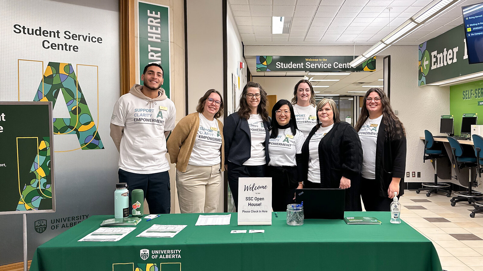 Staff at the Student Service Centre pose in front of their booth.