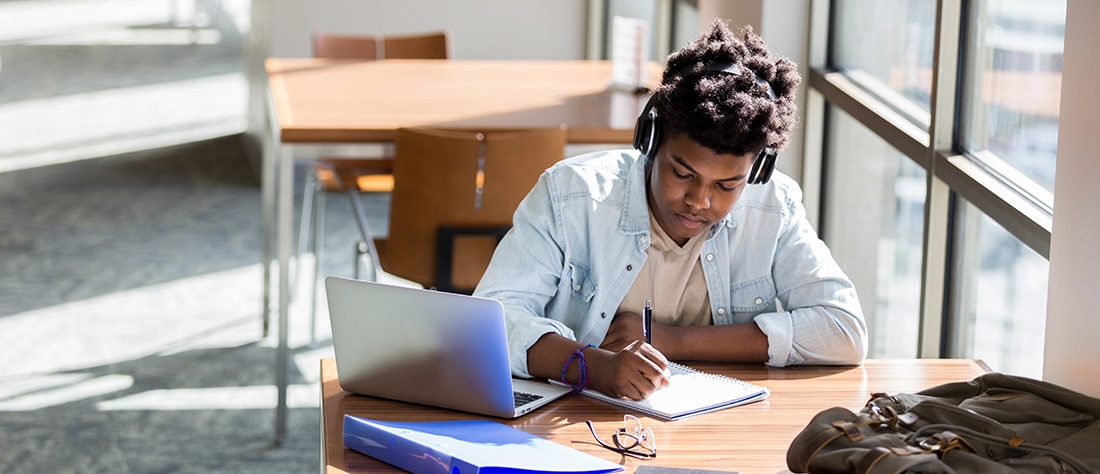 Student studying near a window