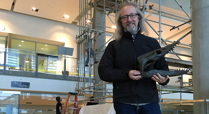 Michael Caldwell holding a plesiosaur skull